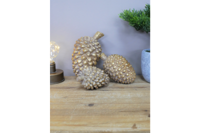 set of three gold pinecones £19.99